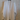 Oversized Linen White Blouse on a hanger against a wooden background
