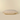 A rectangular lumbar pillow in a textured cream fabric with a cream ribbed pattern.