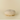A round, tufted floor cushion or pouf in a light cream fabric