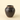 A small dark brown glazed ceramic jar with a natural terracotta rim