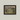 Framed painting of a landscape with a bridge on a gray wall.  The Bridge At Argenteuil Framed.
