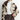 Woman standing in a furry coat with cow type markings.
