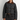 Woman modelling a black jacket with a brown collar.