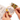 A person's hands hold a wooden embroidery hoop with a cross-stitch pattern that reads 'A DOOR ALWAYS KEEPS REALITY AWAY' in gray thread. The hoop contains multicolored stitched sections on the left, and a package of multicolored embroidery floss is visible on the right.
