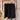 Tie Waist Linen Black Shorts on a hanger against a wooden wall background