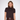 A model wearing a dark brown short-sleeve knit top with a brown faux-fur collar and a matching dark brown faux-leather skirt, set against a plain light gray background.