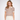 A woman modeling a short-sleeve knit polo shirt with horizontal stripes in beige, orange, blue, and brown, paired with cream-colored trousers, against a plain white studio background.